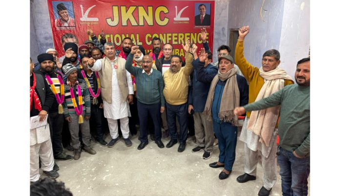 Workers raising slogans during joining of National Conference on Sunday.