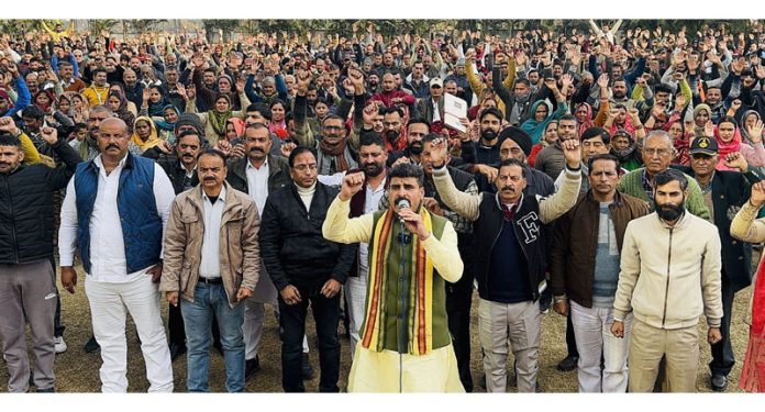 Pawan Khajuria with his supporters at the workers meeting in Udhampur on Sunday.