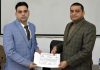 Rajinder Kumar Gupta, Deputy Director Indoor/Trainings, SKPA, providing certificate to a CPIO at SKPA Udhampur on Friday.