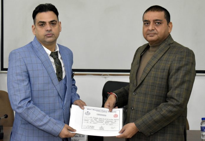 Rajinder Kumar Gupta, Deputy Director Indoor/Trainings, SKPA, providing certificate to a CPIO at SKPA Udhampur on Friday.