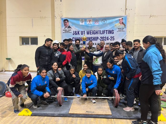 President J&K Olympic Association Dushyant Sharma posing along with Weightlifters at Jammu.