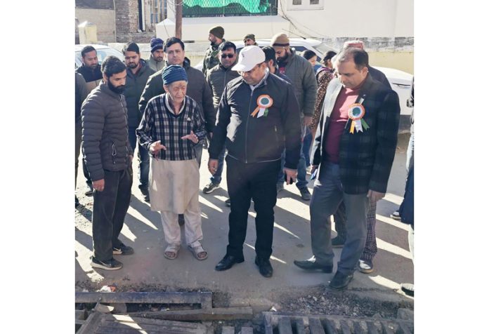 DC inspecting road improvement works on peripheries of Kishtwar town.