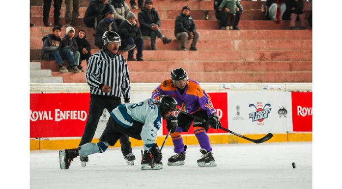 Players in action during a match of Royal Enfield Ice Hockey League at NDS Stadium in Leh on Sunday.