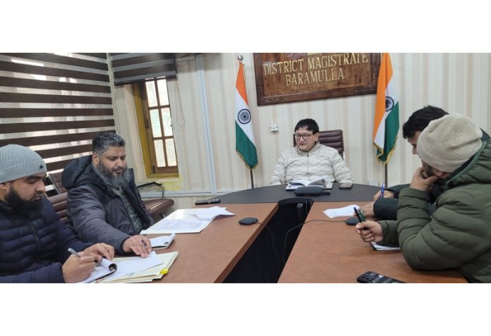 DC Baramulla, Minga Sherpa chairing a meeting.