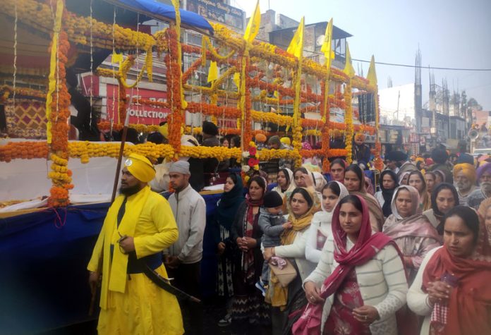 Sikh community members taking out Nagar Kirtan in Akhnoor town on Sunday.