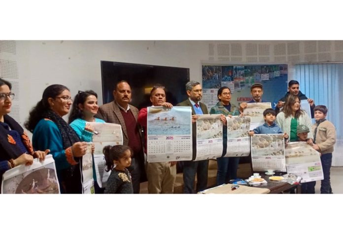 Chief Wildlife Warden Sarvesh Rai and others releasing the calendar.