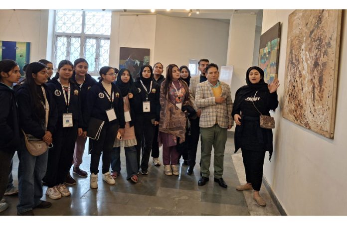 Group of students from various colleges exploring the exhibition gallery during visit to Kala Kendra Jammu on Wednesday.