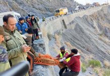 Rescuers retrieve bodies of accident victims from a gorge in Ramban on Friday. -Excelsior/Parvez