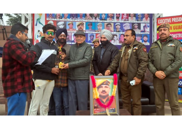 Player of the match receiving award during prize distribution ceremony at Kathua.