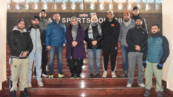 Dignitaries posing along with selected Carrom players.