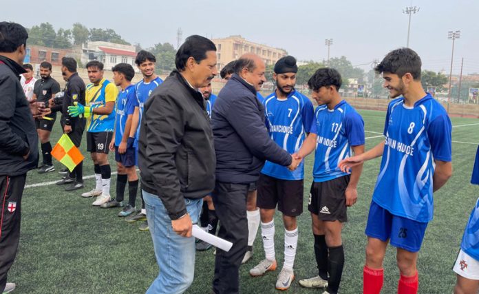 Chief guest interacting with players before start of Football match at Mini Stadium Parade.