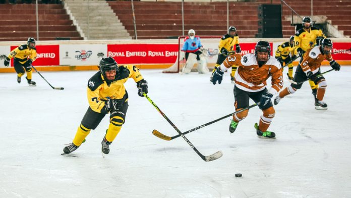 Players in action during an Ice Hockey match at the Nawang Dorjay Stobdan Stadium in Leh on Monday.