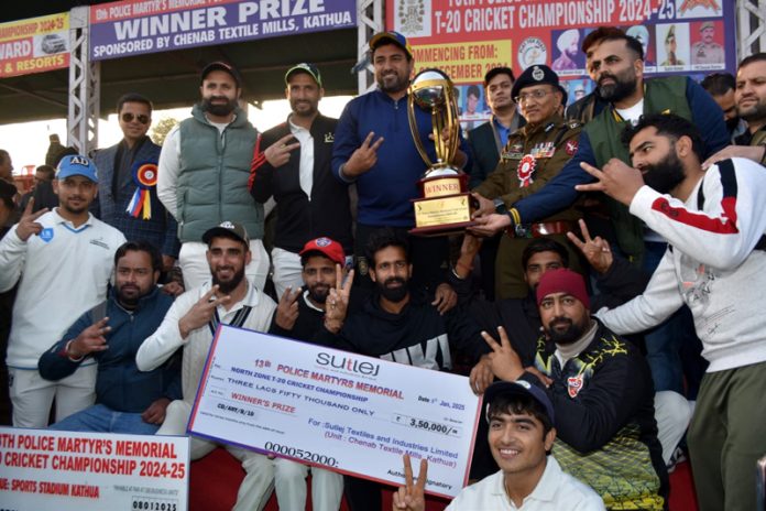 Chief Guest ADGP Jammu Zone Anand Jain presenting trophy to the winning team at Kathua during 13th Police Martyr's Memorial North Zone T-20 Cricket Championship.