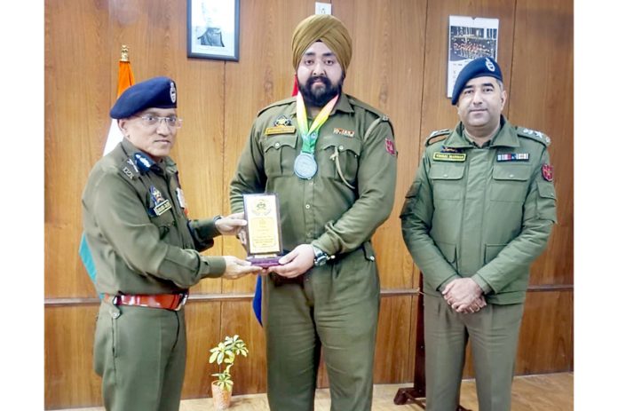 ADGP Jammu Zone Anand Jain felicitating SPO Manpreet for winning the silver medal at the national level event.