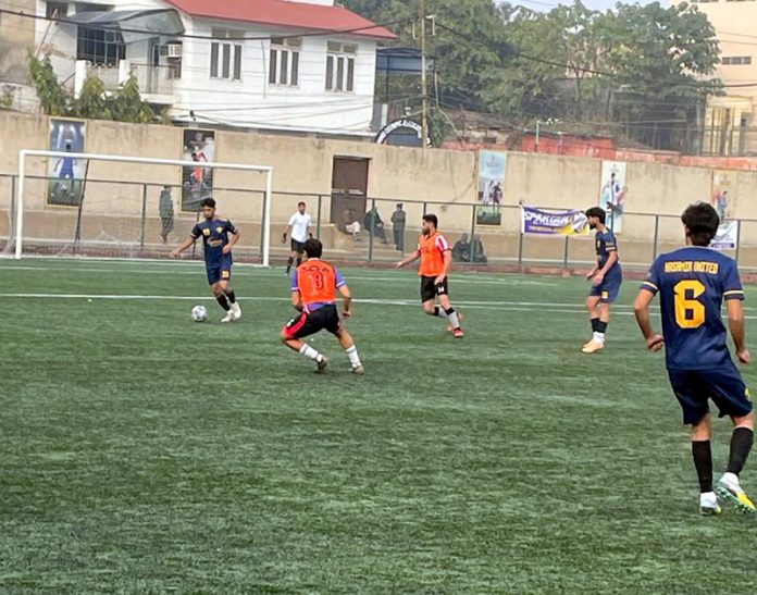 Players in action during a football match at Mini Stadium Parade, Jammu on Thursday.