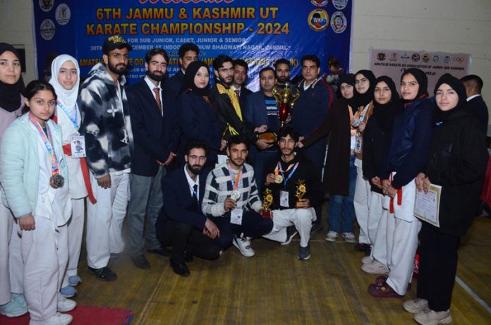 Dignitaries and Karate players posing with medals during closing ceremony of the 6th J&K UT Karate Championship 2024 in Jammu.