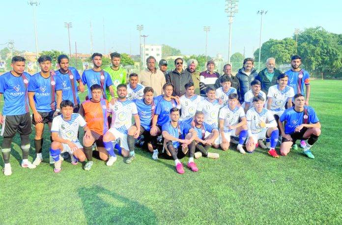 Dignitaries posing along with football teams during a match at Parade Ground Jammu on Thursday.