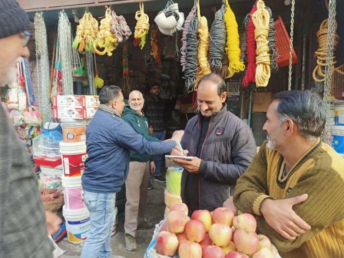 Municipal Committee team removing encroachment in a market of Akhnoor town on Thursday.