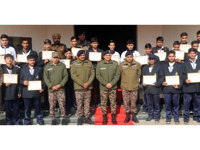 Hariom Khare, Commandant 100 Battalion CRPF posing with the students during a function organised in Jammu on Thursday.