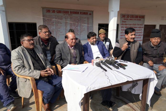 Former president of AJKSGKS Joginder Lal Bhagat along with others during a press conference at Jammu.