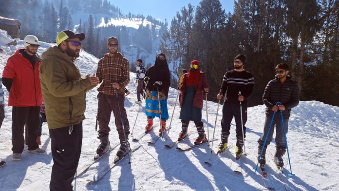 Skiers at Guldanda meadow in Bhaderwah on Tuesday. -Excelsior/Tilak Raj