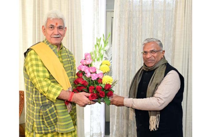 Deputy Chairman, Rajya Sabha, Harivansh presenting a flower bouquet to LG Manoj Sinha.