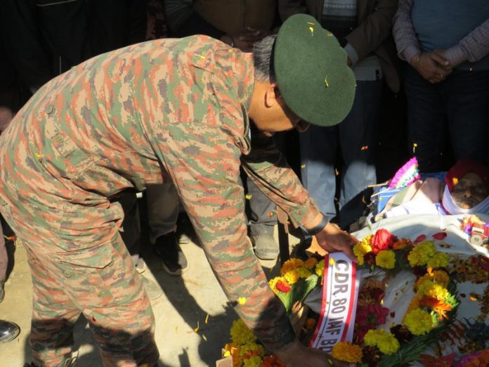 Brigadier Bir Bikram laying wreath on mortal remains of Hav Baldev Singh. —Excelsior/Imran