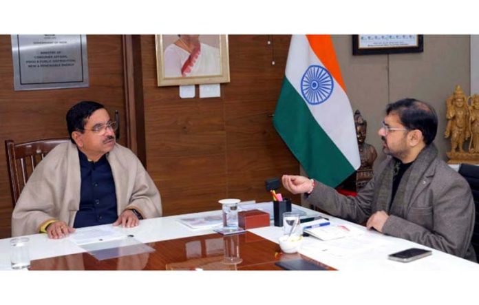 Minister Satish Sharma during meeting with Union Minister Pralhad Joshi.