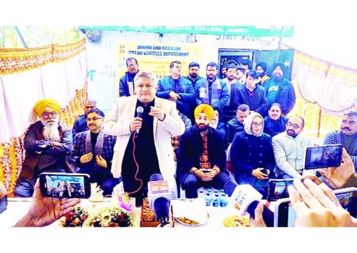 Transport Commissioner Vishesh Mahajan addressing drivers and conductors during an awareness camp at Maheshpura Chowk, Jammu.