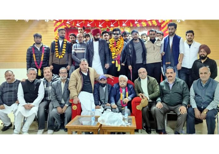 Former Minister Ajay Kumar Sadhotra posing along with students during a function organised in Nagrota on Wednesday.