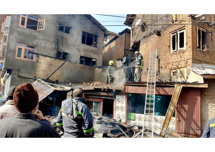 View of damaged structure after blaze at Nowhatta in Srinagar on Tuesday. — Excelsior/Shakeel