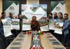 Hamida Akhter, GM District Industries Center unveiling calendar of Khyber Cement in Srinagar on Friday.