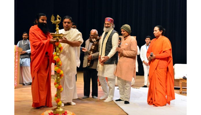 Patanjali University Chancellor, Swami Ramdev lighting ceremonial lamp to inaugurate a function in Haridwar on Saturday.