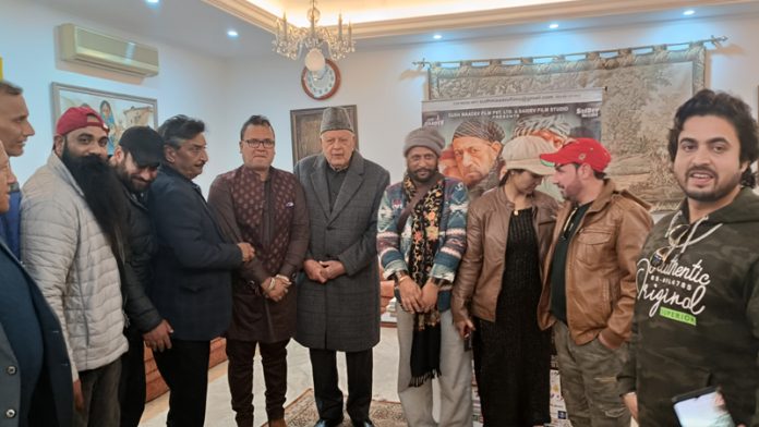 Team of blockbuster film ‘Jammu 86 Gangwar’ posing with NC president Dr Farooq Abdullah at his residence in Jammu.