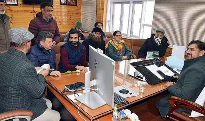 Minister Satish Sharma chairing a meeting at Civil Secretariat Srinagar on Friday.