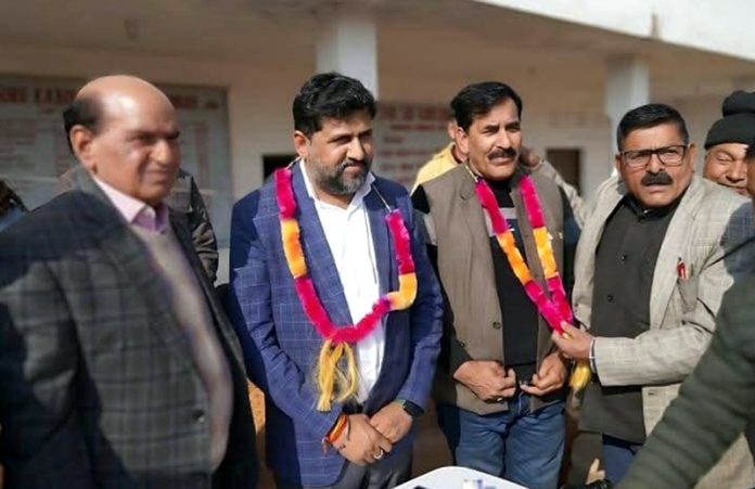 Shamsher Chand along with others after being elected as president of J&K Satguru Kabir Sabha in Jammu on Tuesday.