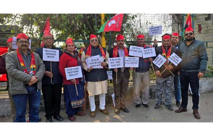 Activists of SP protesting in front of Press Club Jammu on Sunday.