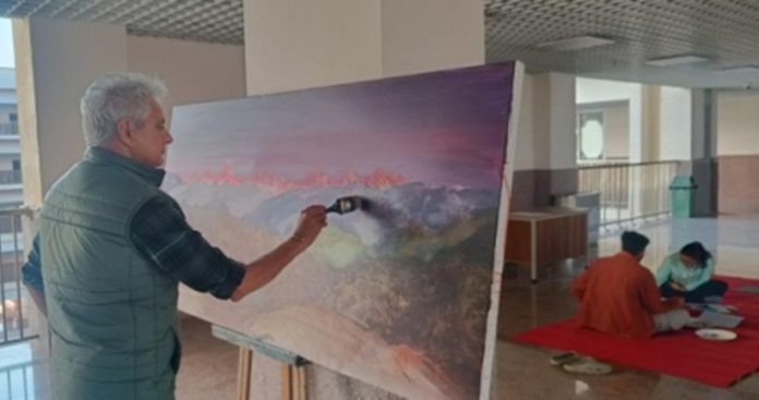 Acclaimed artist K.K Gandhi busy in his art work during a workshop at IIT Jammu.