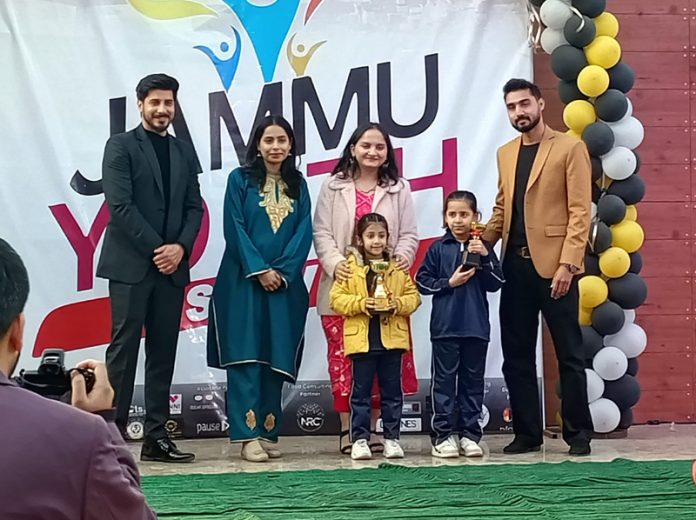 Students posing with trophies during prize distribution ceremony at Jammu.