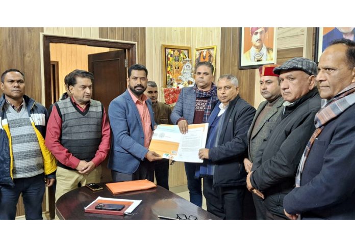 A representative AJBRCEAK handing over a memorandum to BJP president, Sat Sharma (CA) at Jammu on Tuesday.