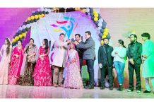 Dignitaries posing alongside participants during the Jammu Youth Festival.