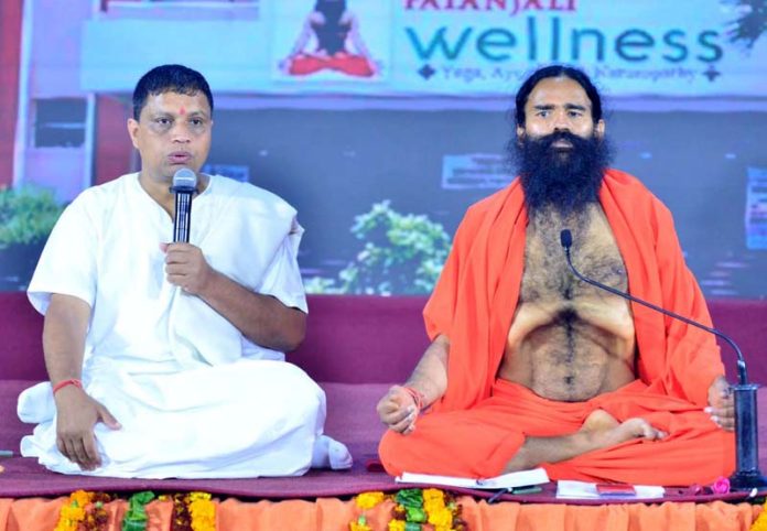 Swami Ramdev and Acharya Balkrishna addressing saints at Patanjali Yogpeeth Haridwar on Sunday.