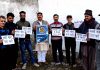 MSJK activists holding placards during a protest in Jammu.