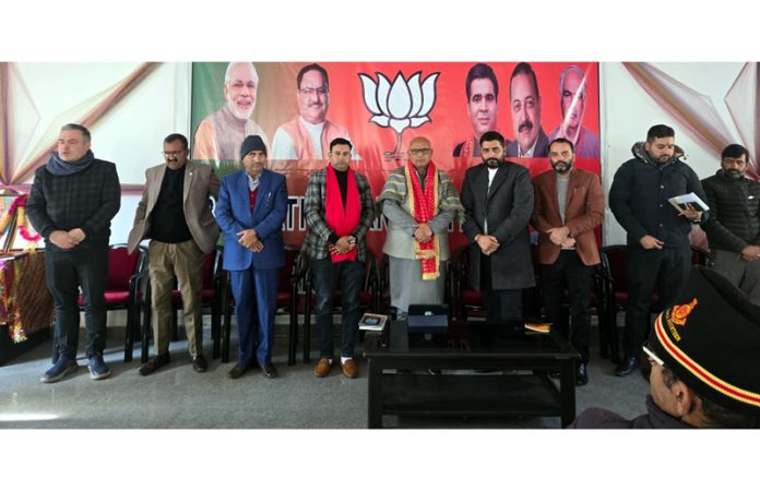 Former Mayor Rajinder Sharma posing with party workers of Ramban district in Jammu on Sunday.