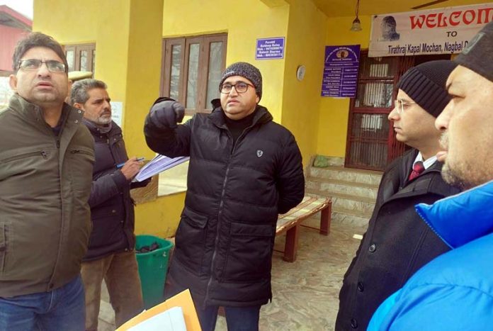 Director Archives K K Sidha and other officers during visit to Kapal Mochan Shrine, Shopian on Thursday.