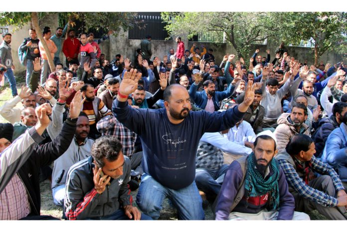 PDD daily wagers staging protest outside MD JPDCL's office in Jammu on Tuesday. —Excelsior/Rakesh