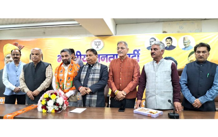 Sat Sharma, president, J&K BJP felicitating Farooq Ganderbali after he joined the party in Jammu on Tuesday. Sat Sharma, president, J&K BJP felicitating Farooq Ganderbali after he joined the party in Jammu on Tuesday.