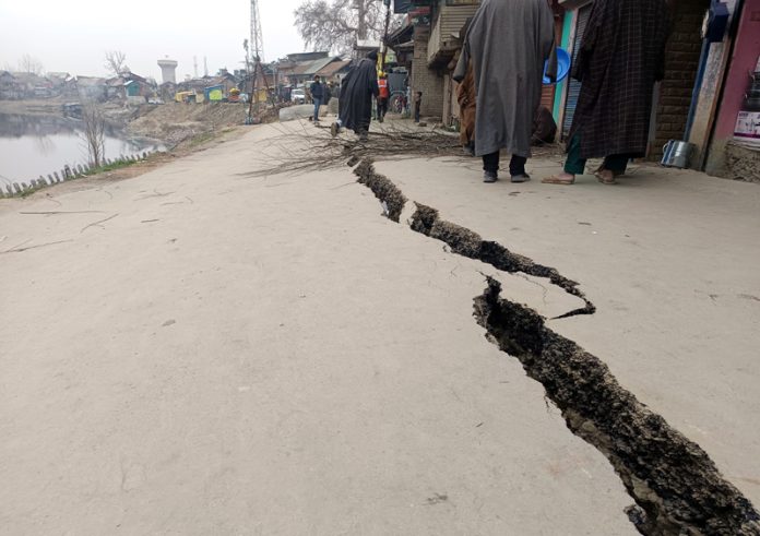 Cracks on a road along Jhelum in Hajin town in north Kashmir’s Bandipora district on Tuesday. — Excelsior/Aabid Nabi Cracks on a road along Jhelum in Hajin town in north Kashmir’s Bandipora district on Tuesday. — Excelsior/Aabid Nabi