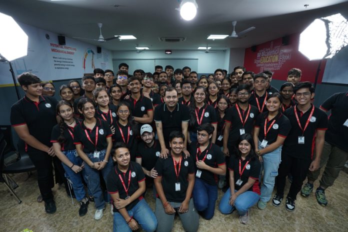 The topper students of PW along with their faculty posing for a photograph on Monday.