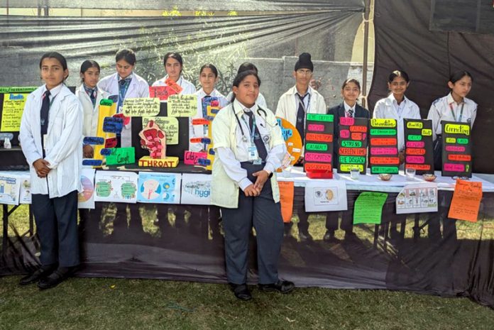 Students presenting their science projects during the exhibition.